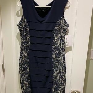 Woman’s navy dress. Very flattering. Size 8. Lace detail